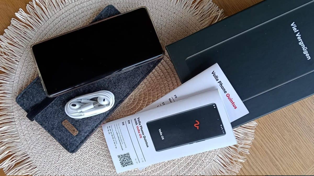 Volla Phone plus accessories on table, box included, photo take from above